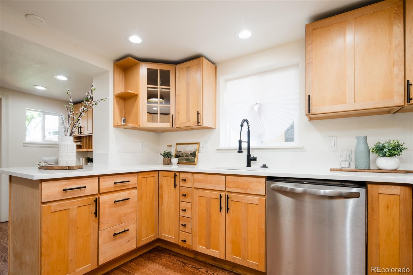 3519 L Newton Street Denver, CO 80211 - Photo 8 of 40 a kitchen with white cabinets and sink