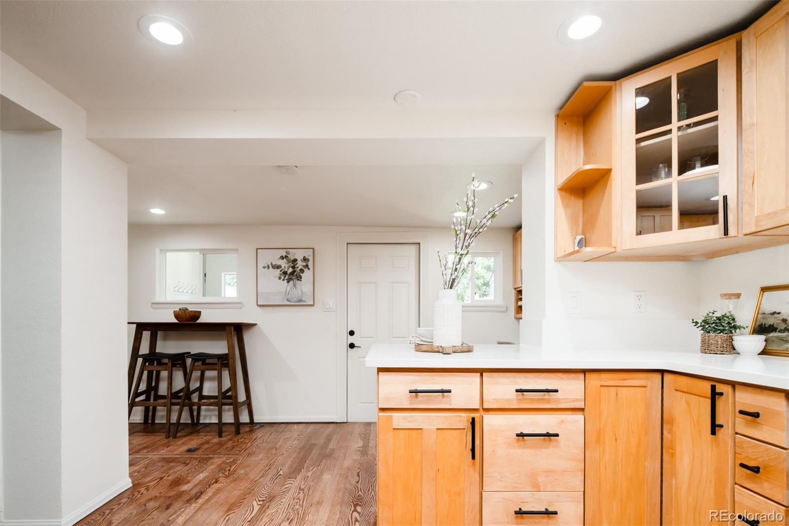 3519 L Newton Street Denver, CO 80211 - Photo 9 of 40 a kitchen with stainless steel appliances granite countertop a sink and cabinets