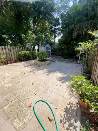 a backyard of a house with lots of green space