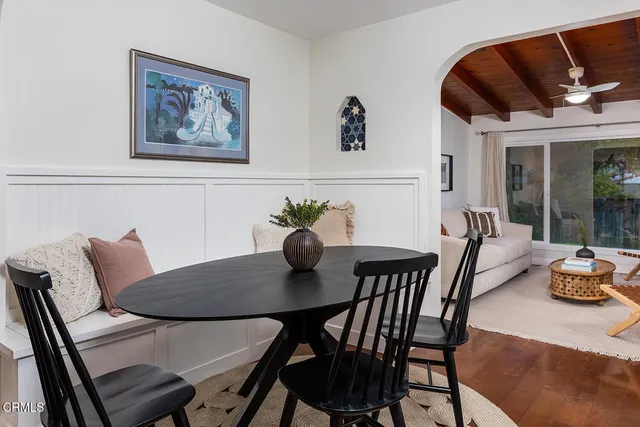 a bedroom with furniture and large windows