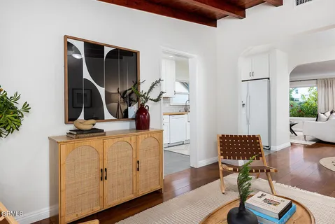 a kitchen with stainless steel appliances granite countertop a stove a sink and a white cabinets