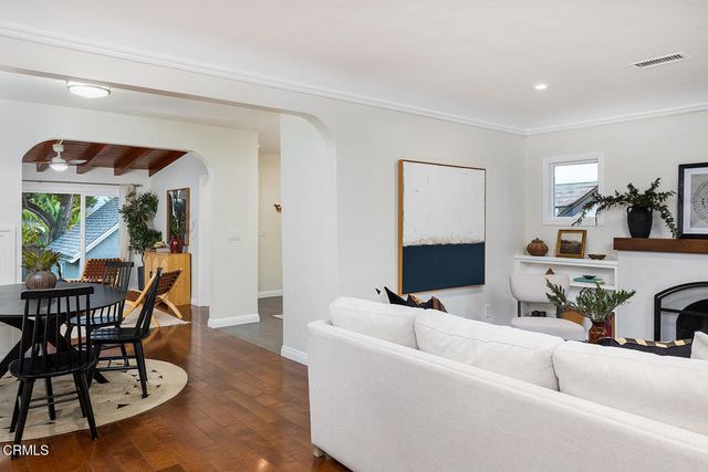 a view of a dining room with furniture and wooden floor