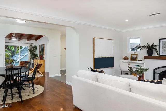 a view of a dining room with furniture and wooden floor