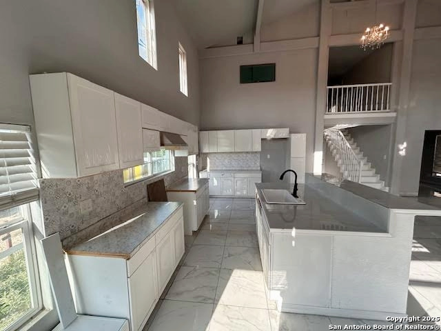 236 Hopi Bandera, TX 78003 - Photo 25 of 34 a large white kitchen with a large window