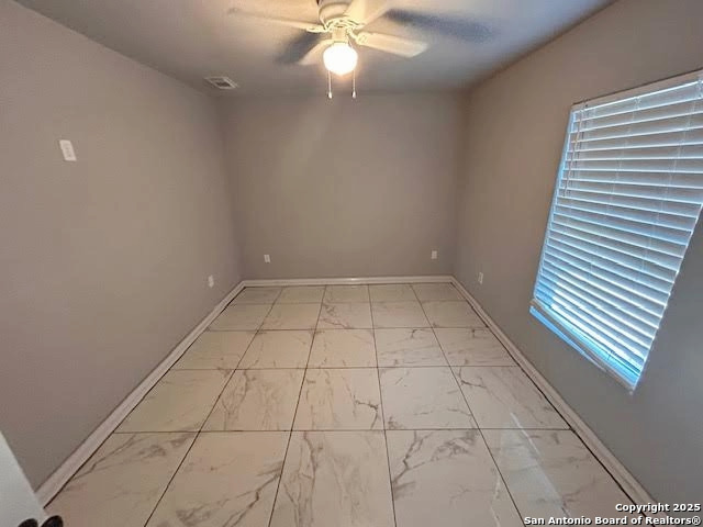 236 Hopi Bandera, TX 78003 - Photo 9 of 34 wooden floor in an empty room with a window