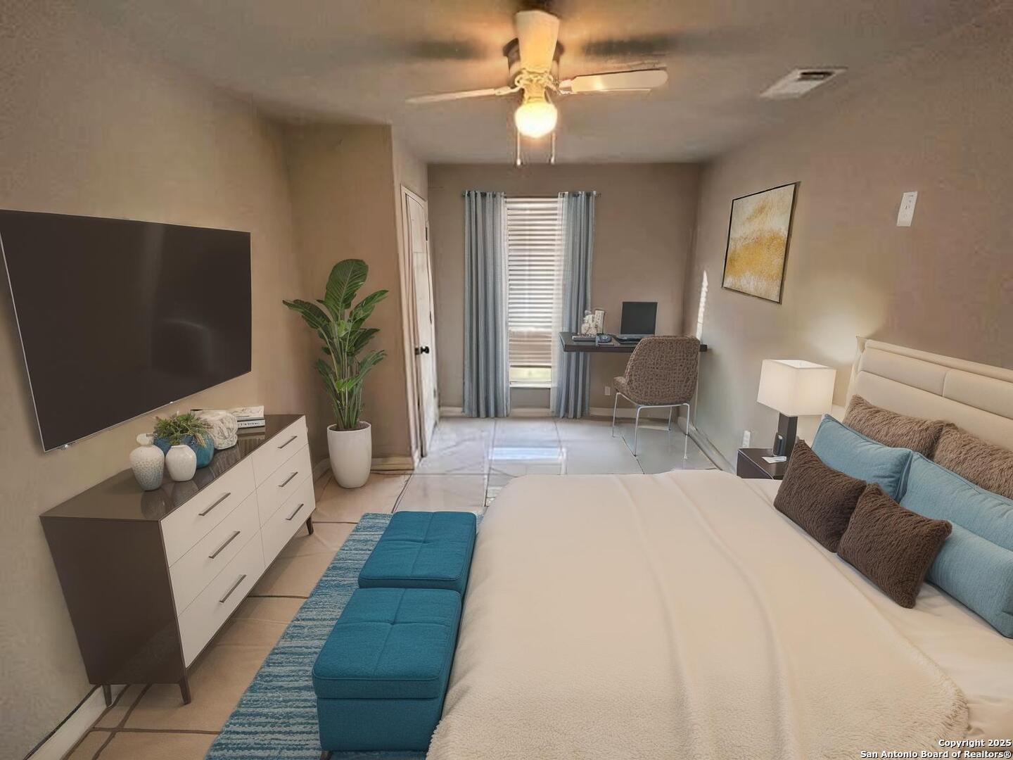 236 Hopi Bandera, TX 78003 - Photo 10 of 34 a bedroom with a bed and a flat screen tv