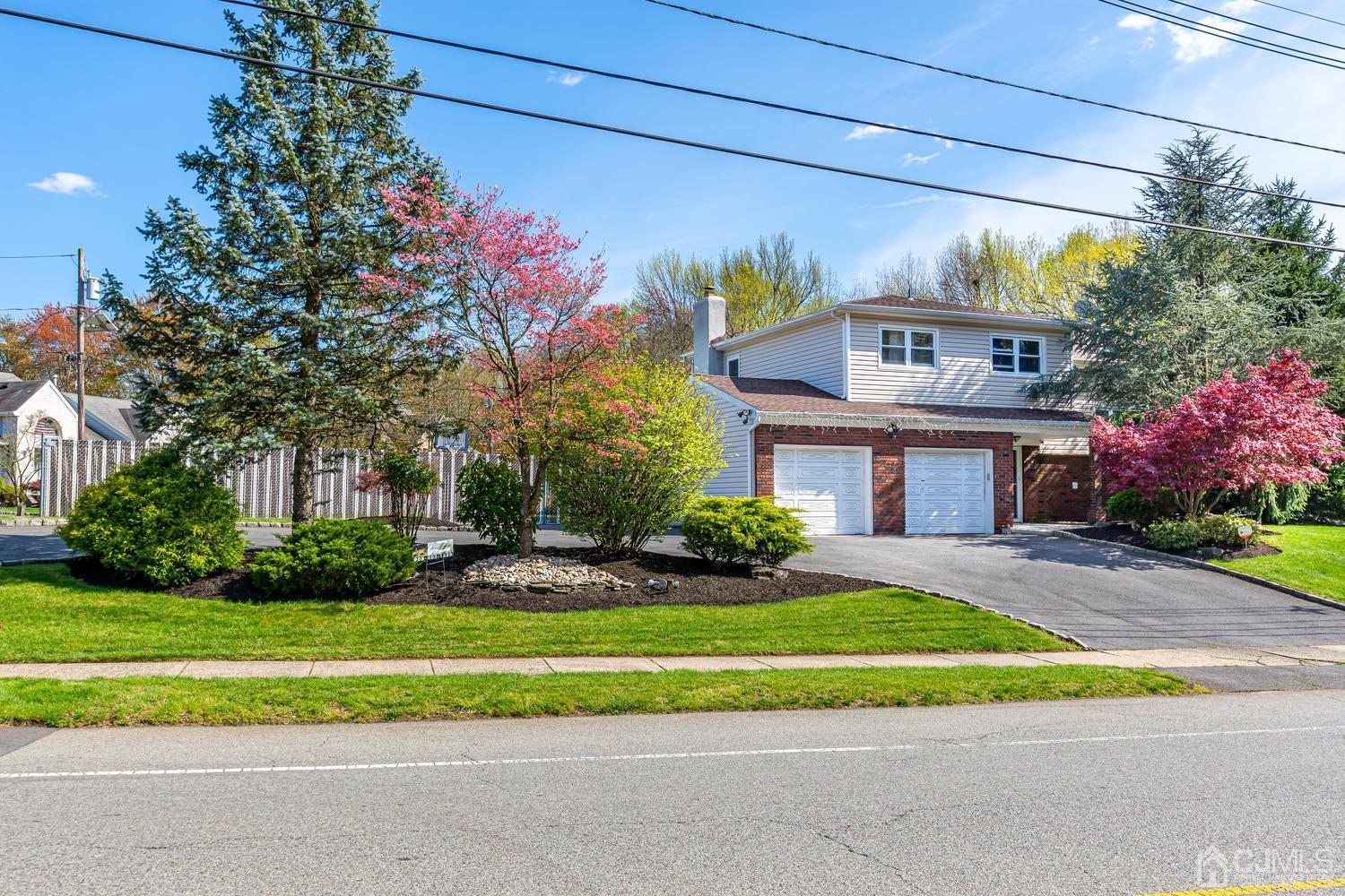 983 New Dover Road Edison, NJ 08820 - Photo 1 of 25 a front view of house with yard and green space