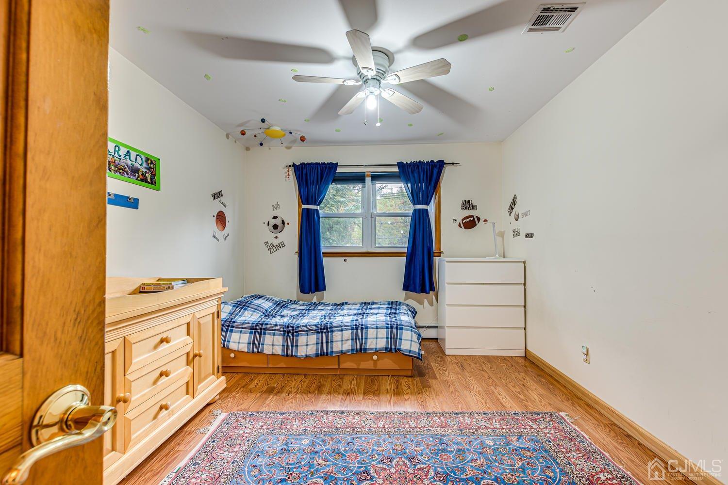 983 New Dover Road Edison, NJ 08820 - Photo 15 of 25 a room with natural light and a rug