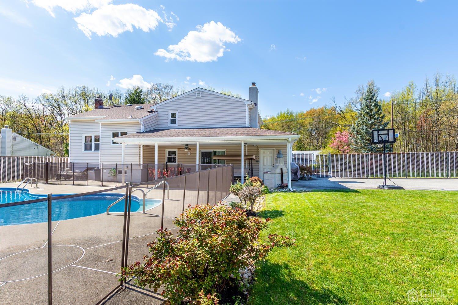 983 New Dover Road Edison, NJ 08820 - Photo 22 of 25 a view of a house with a yard porch and sitting area