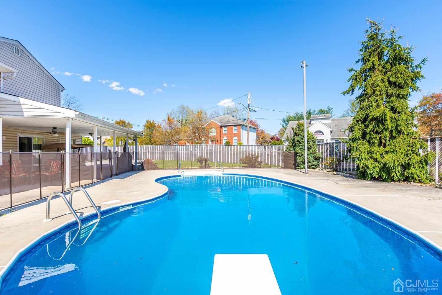 983 New Dover Road Edison, NJ 08820 - Photo 23 of 25 a swimming pool with outdoor seating and yard