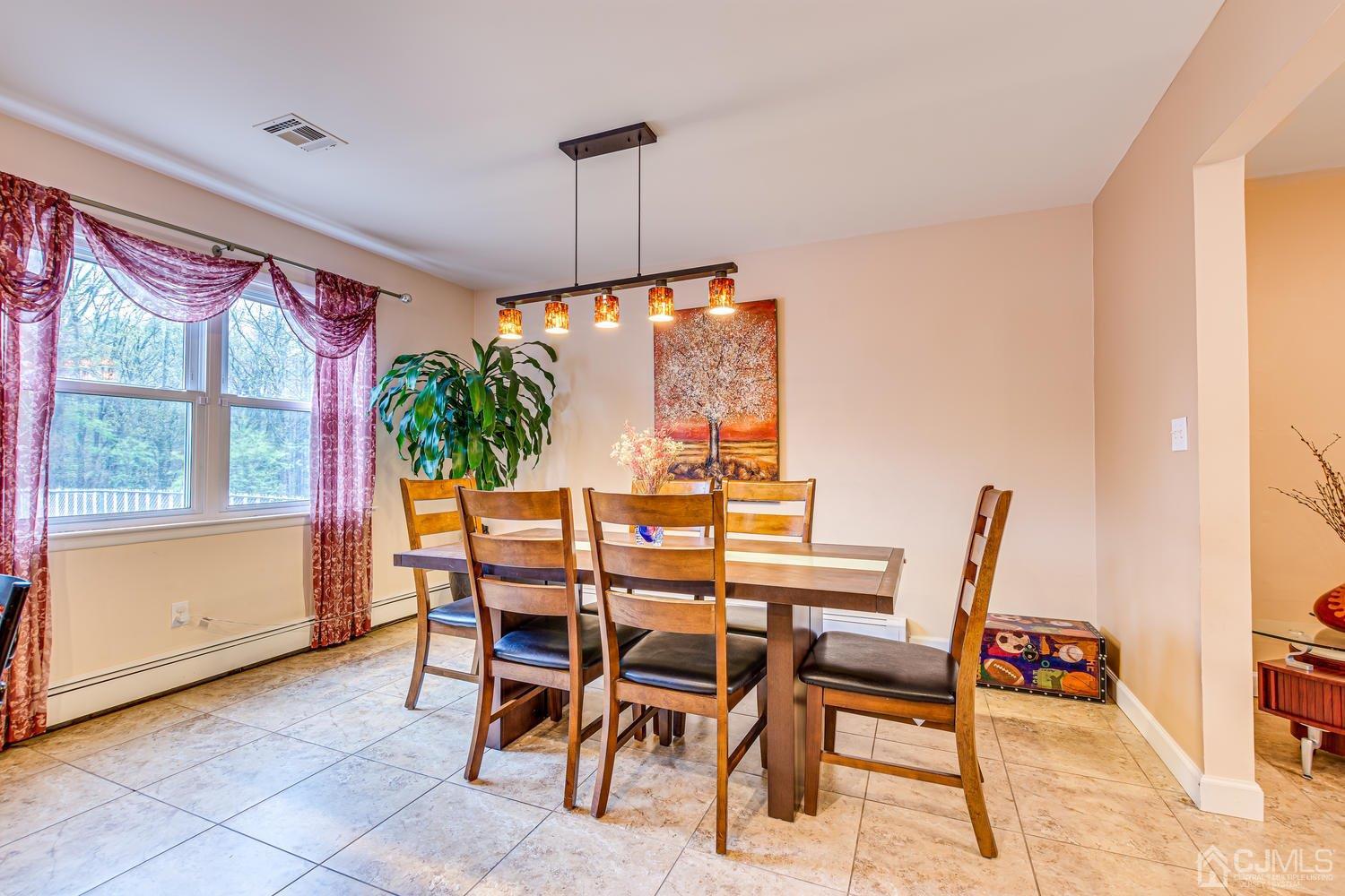 983 New Dover Road Edison, NJ 08820 - Photo 6 of 25 a view of a dining room with furniture window and outside view