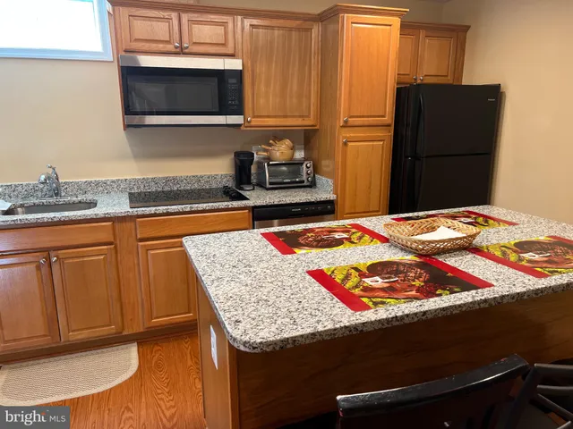 a bedroom with a bed and cabinets