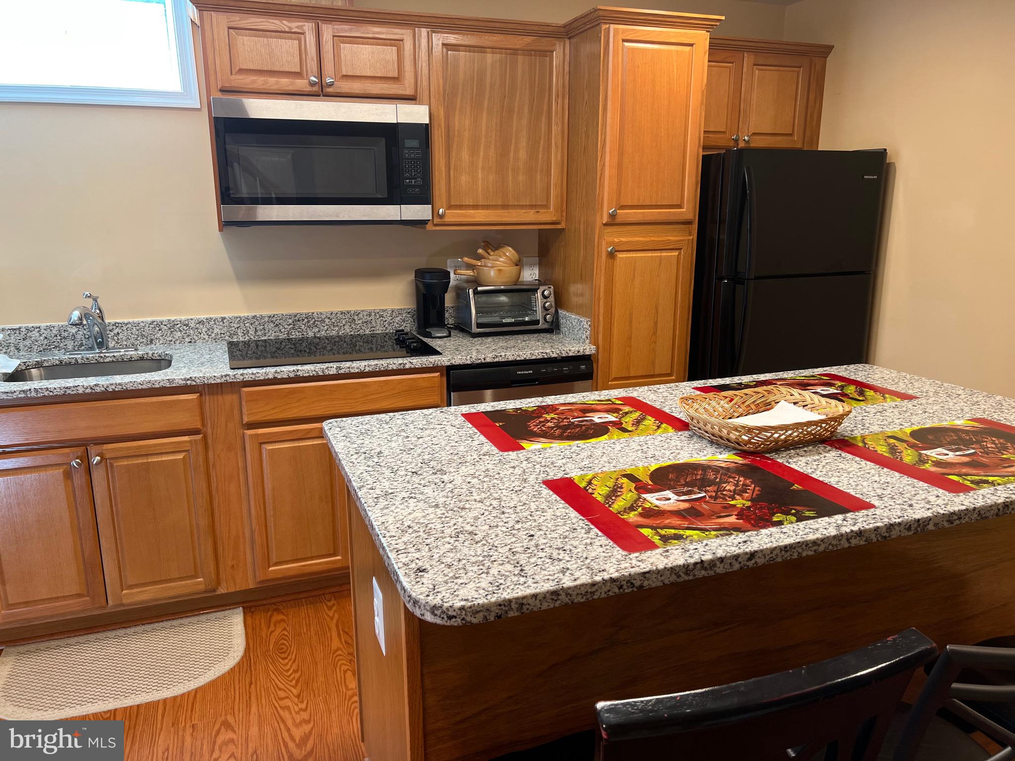 5802 Telluride Lane, Unit BASEMENT APARTMENT Spotsylvania, VA 22553 - Photo 21 of 35 a bedroom with a bed and cabinets