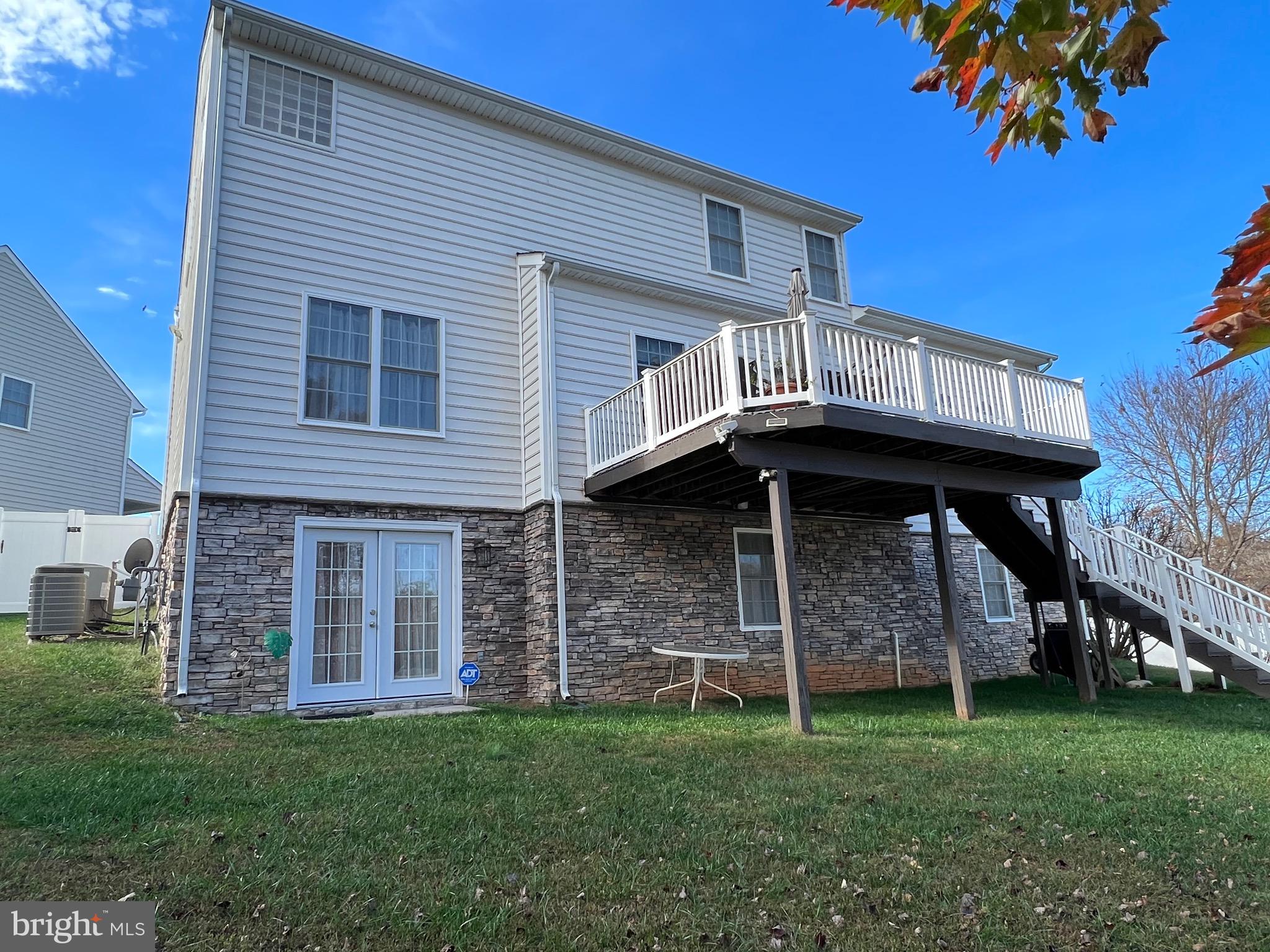 5802 Telluride Lane, Unit BASEMENT APARTMENT Spotsylvania, VA 22553 - Photo 34 of 35 a front view of a house with a garden