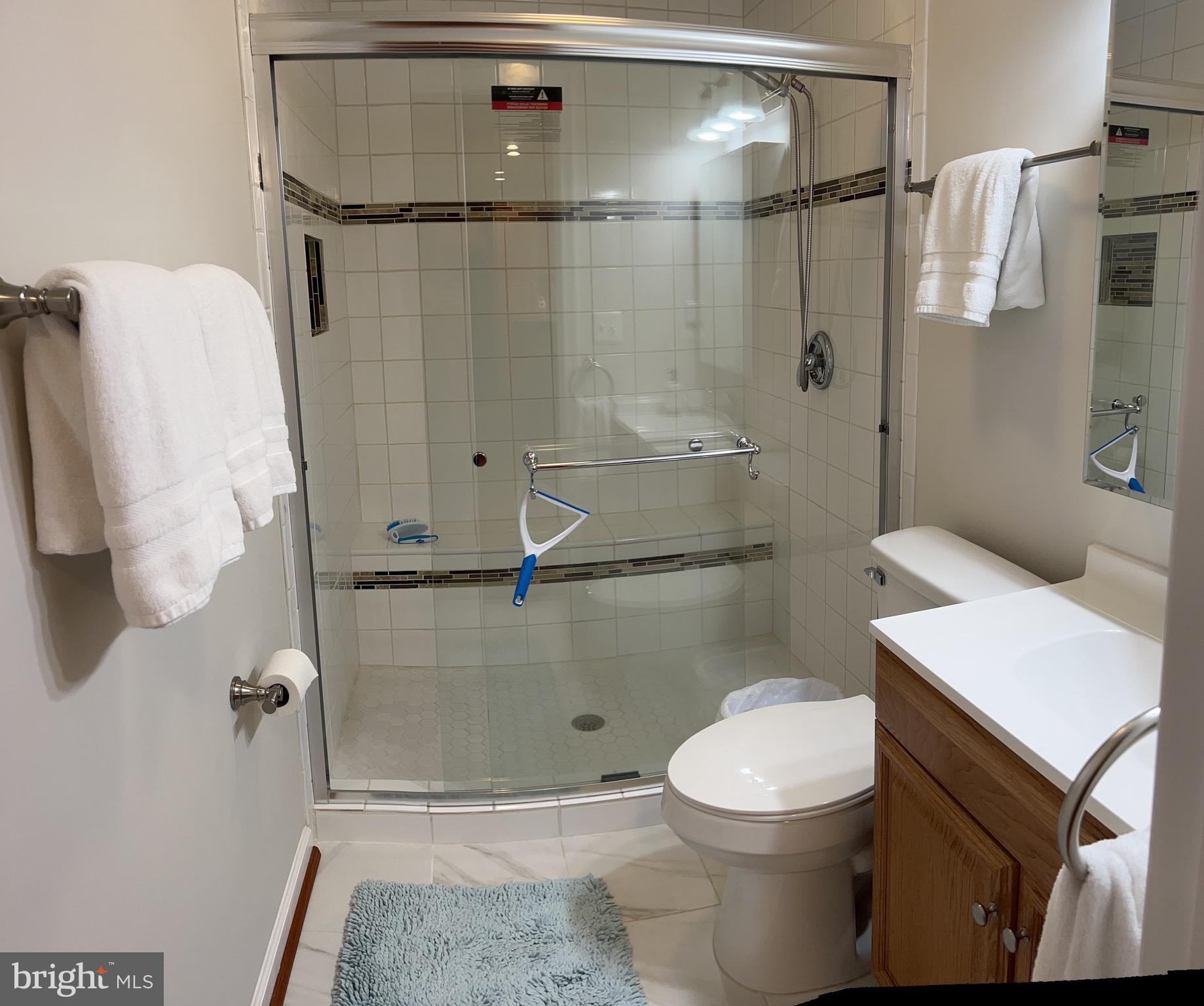 5802 Telluride Lane, Unit BASEMENT APARTMENT Spotsylvania, VA 22553 - Photo 4 of 35 a bathroom with a toilet and a shower