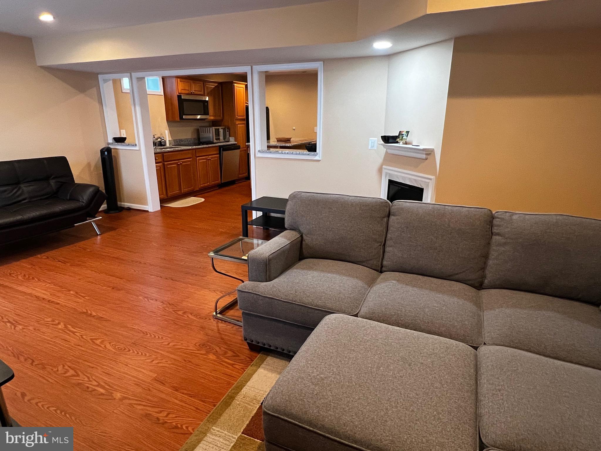 5802 Telluride Lane, Unit BASEMENT APARTMENT Spotsylvania, VA 22553 - Photo 10 of 35 a living room with furniture and a flat screen tv