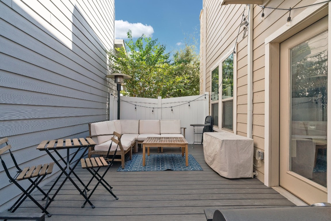 8002 Mandela Bend Austin, TX 78744 - Photo 18 of 24 a view of a patio with table and chairs and potted plants