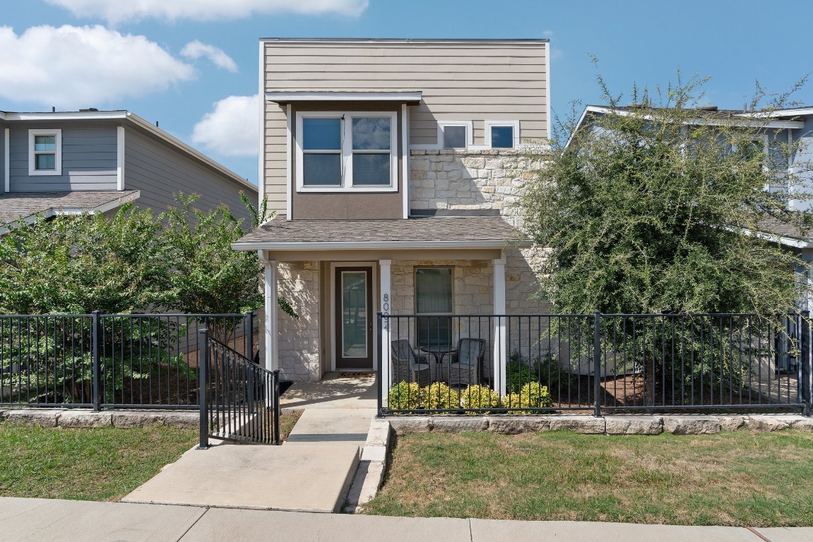 8002 Mandela Bend Austin, TX 78744 - Photo 2 of 24 a view of a house with a yard and sitting area
