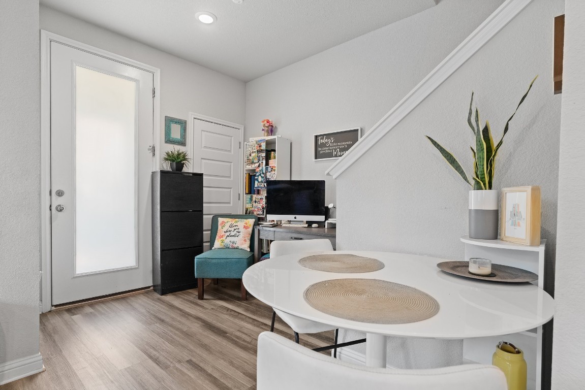 8002 Mandela Bend Austin, TX 78744 - Photo 7 of 24 a living room with furniture and a flat screen tv