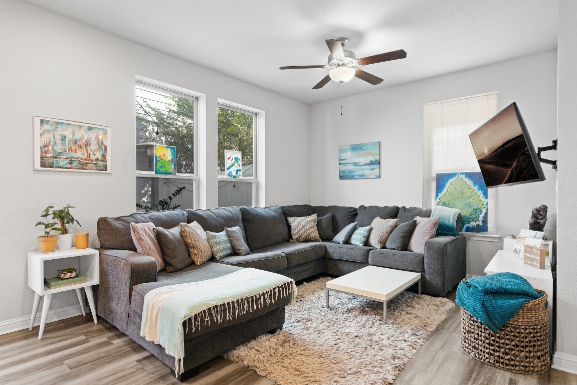 8002 Mandela Bend Austin, TX 78744 - Photo 10 of 24 a living room with furniture a rug and a window