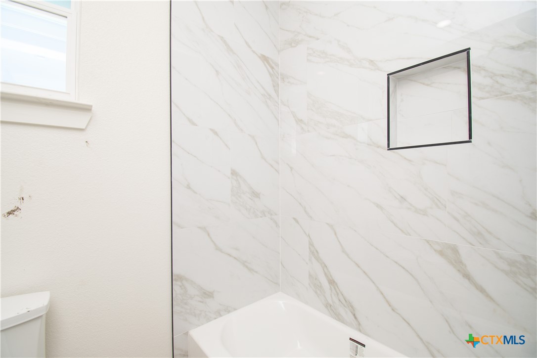 4245 Stringtown Road Temple, TX 76501 - Photo 20 of 25 a picture of a bathroom with a shower