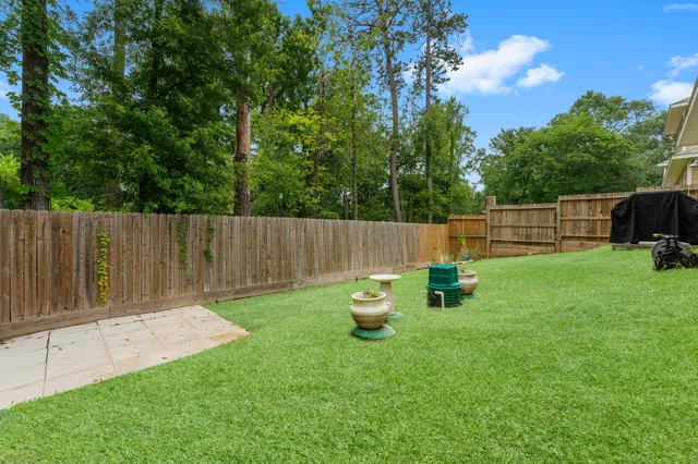 a garden with wooden fence