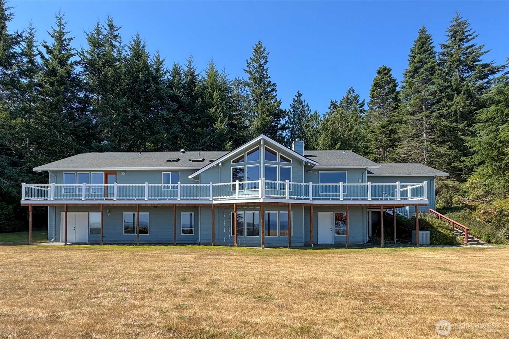 99 South Point Road Port Angeles, WA 98363 - Photo 40 of 40 a front view of a house with a garden and trees