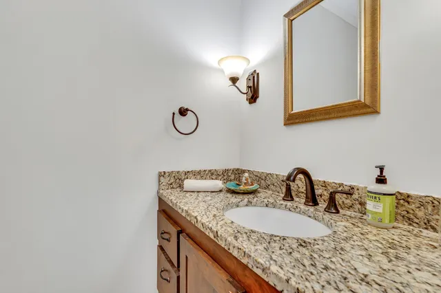 a view of kitchen with furniture and refrigerator