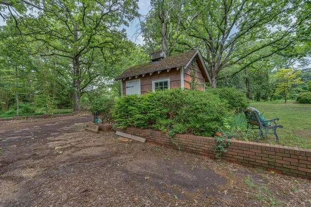 a kitchen with stainless steel appliances granite countertop a sink a counter space and cabinets