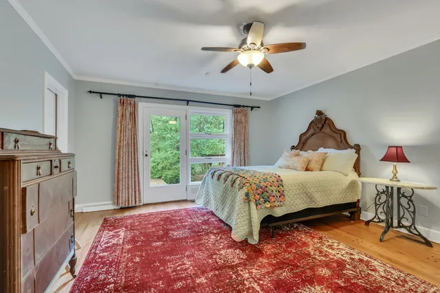 a kitchen with a refrigerator and white cabinets