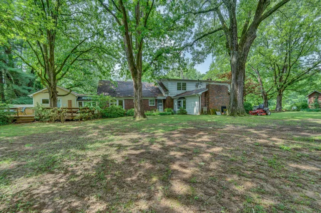 a backyard of a house with lots of green space