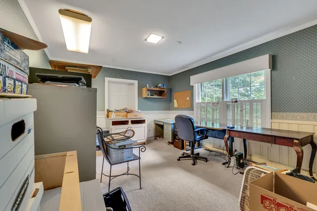 a bed room with a bed and a window