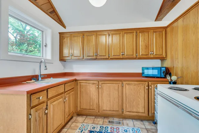 a view of outdoor space with deck and yard