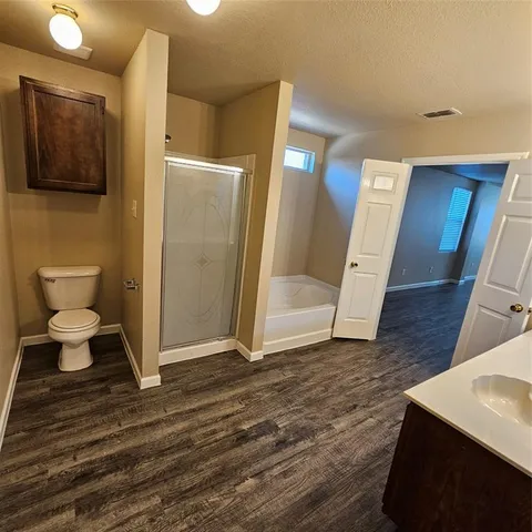 a view of staircase with wooden floor and a fireplace