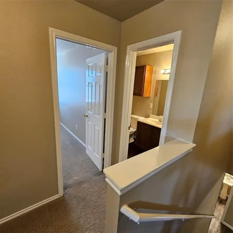 a bathroom with a double vanity sink toilet and shower