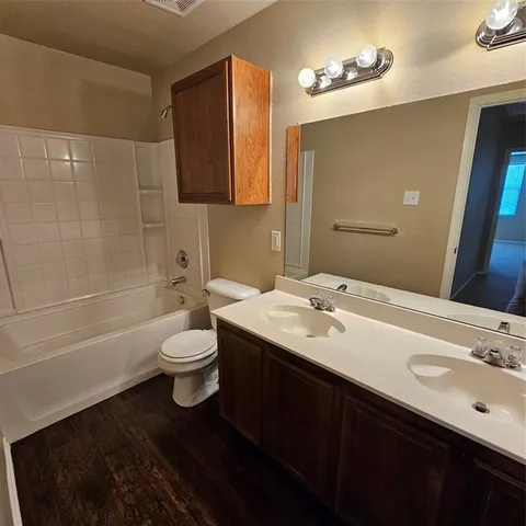 an empty room with a empty space and windows