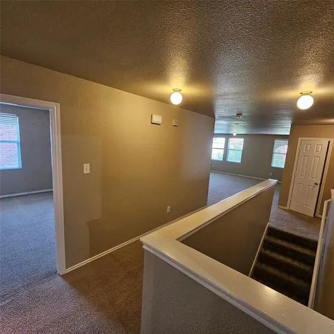 a view of a bathroom from a hallway
