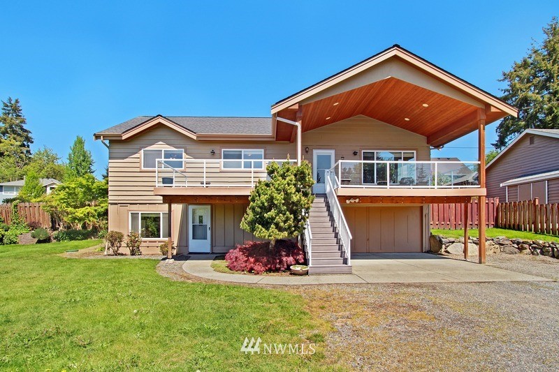 2106 Cedar Road Lake Stevens, WA 98258 - Photo 2 of 24 a front view of a house with a yard