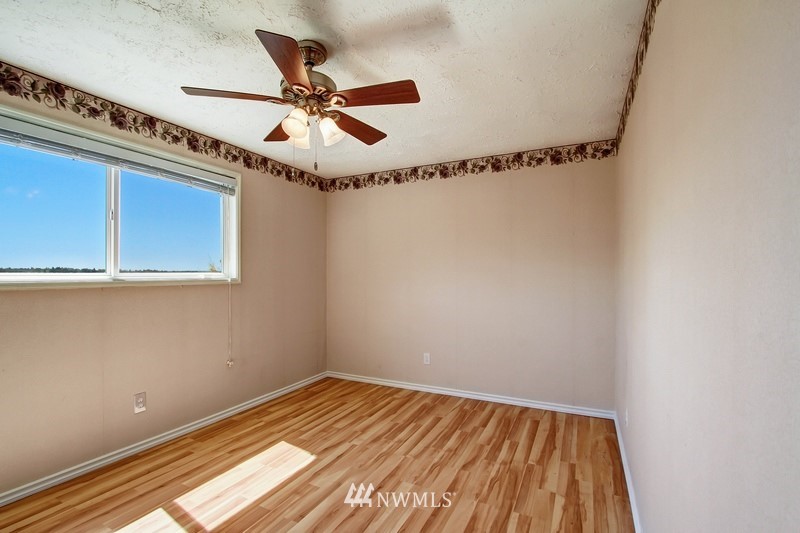 2106 Cedar Road Lake Stevens, WA 98258 - Photo 12 of 24 a view of a room with wooden floor and windows