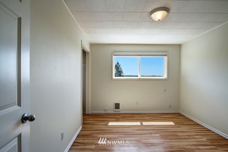 2106 Cedar Road Lake Stevens, WA 98258 - Photo 13 of 24 a view of a hallway with wooden floor