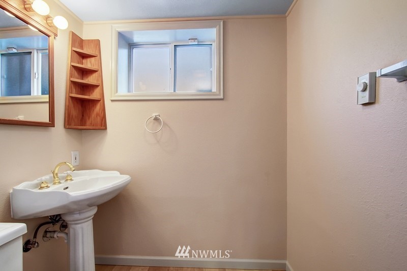 2106 Cedar Road Lake Stevens, WA 98258 - Photo 17 of 24 a bathroom with a sink and a mirror