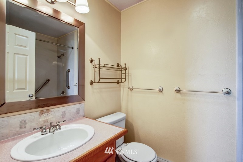 2106 Cedar Road Lake Stevens, WA 98258 - Photo 9 of 24 a bathroom with a sink toilet and mirror