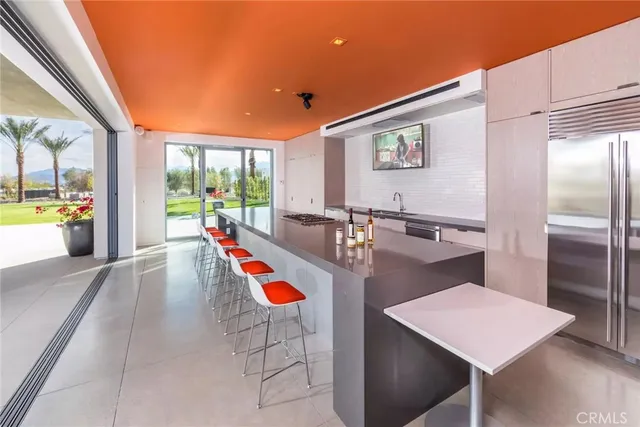 a very nice looking dining room with a large window