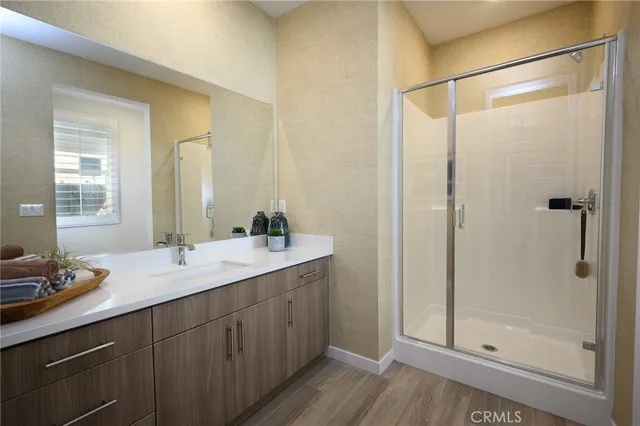 a bathroom with a granite countertop sink mirror and double