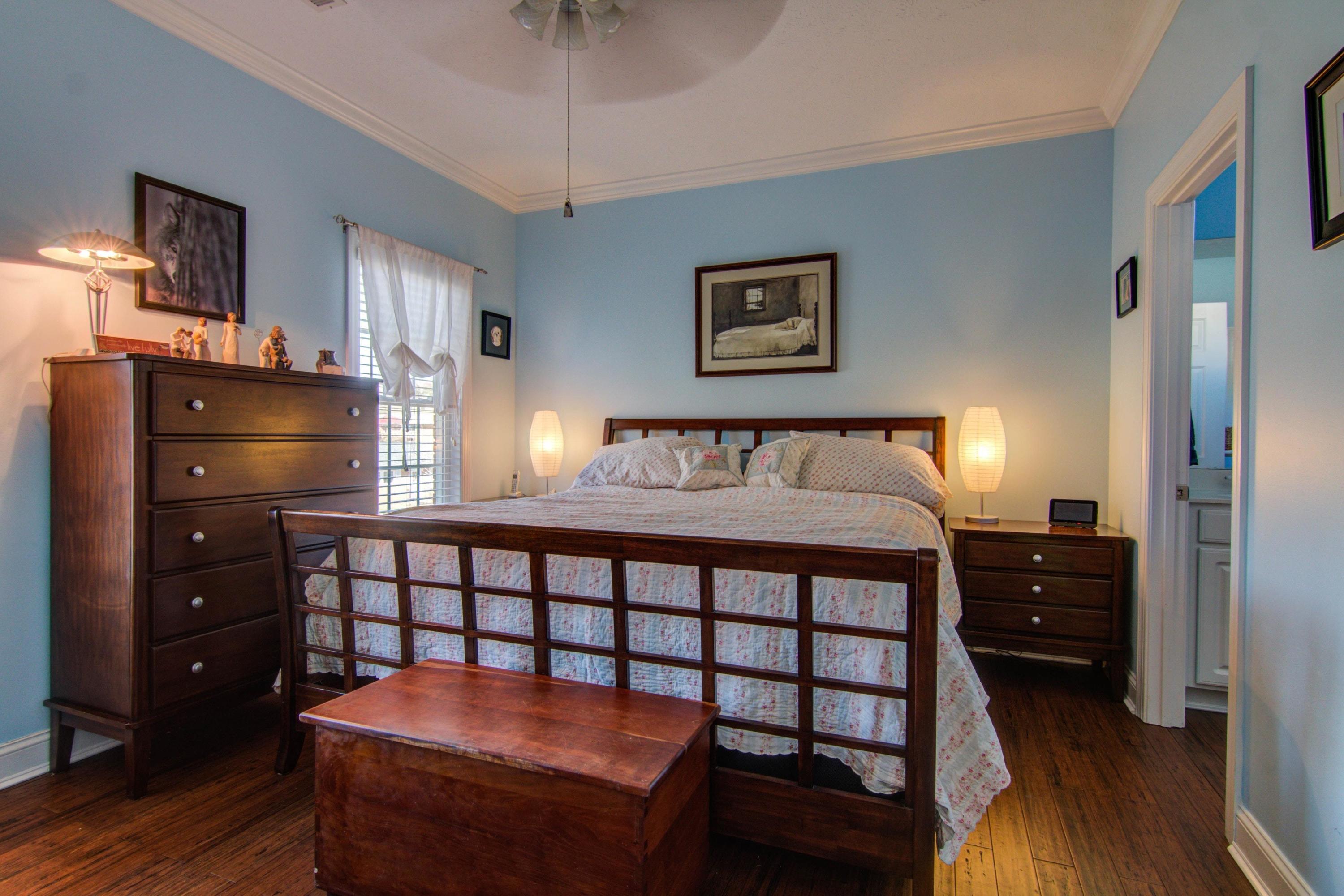 1129 Mountain View Road Vinton, VA 24179 - Photo 12 of 24 a bedroom with a bed and wooden floor
