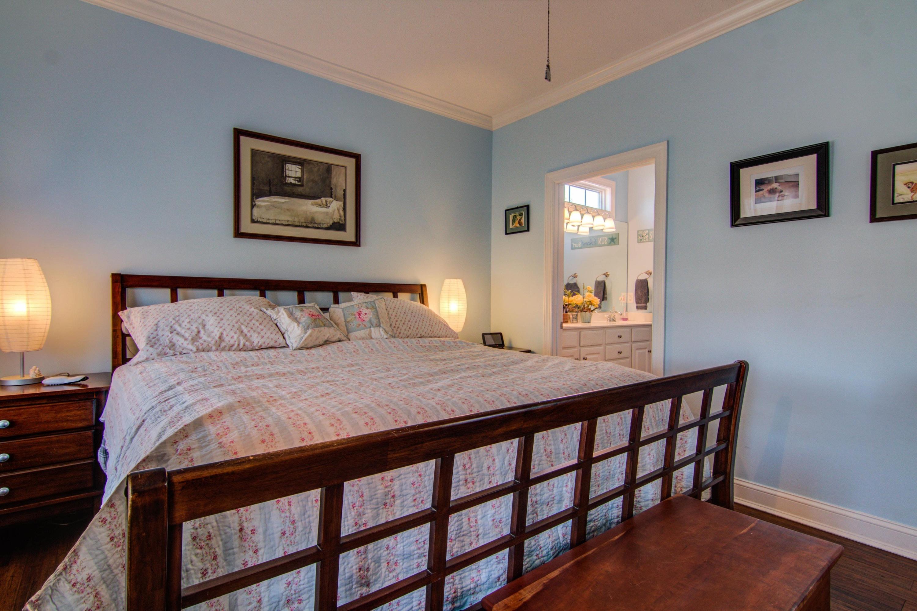 1129 Mountain View Road Vinton, VA 24179 - Photo 13 of 24 a bedroom with a bed and painting on the wall