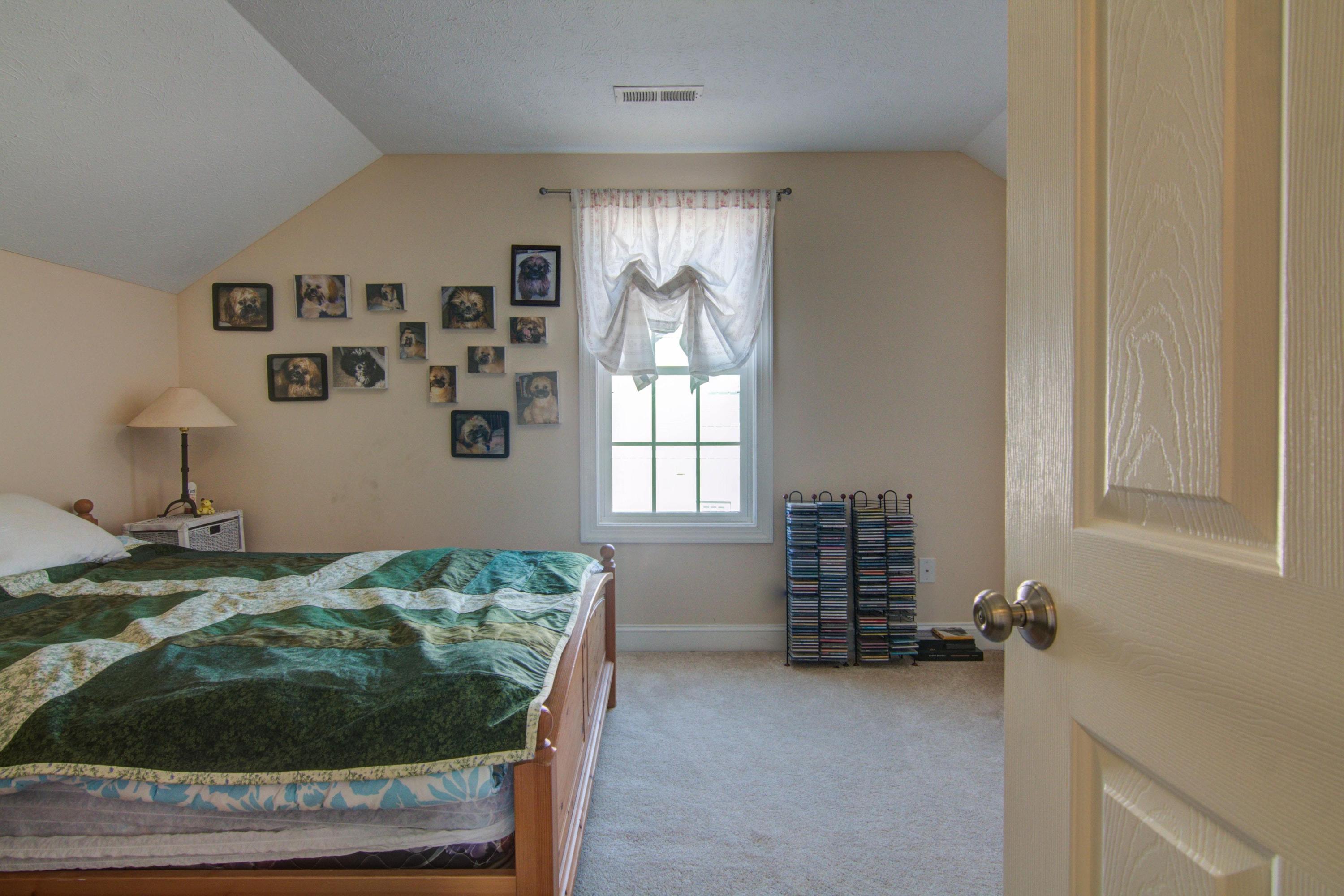 1129 Mountain View Road Vinton, VA 24179 - Photo 19 of 24 a bedroom with a bed and a window
