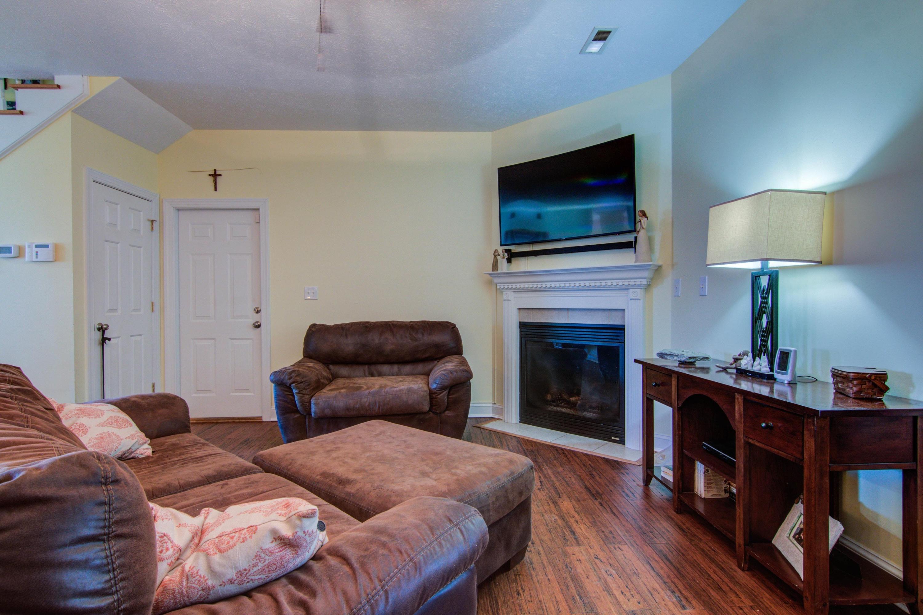 1129 Mountain View Road Vinton, VA 24179 - Photo 6 of 24 a bedroom with furniture fireplace and flat screen tv