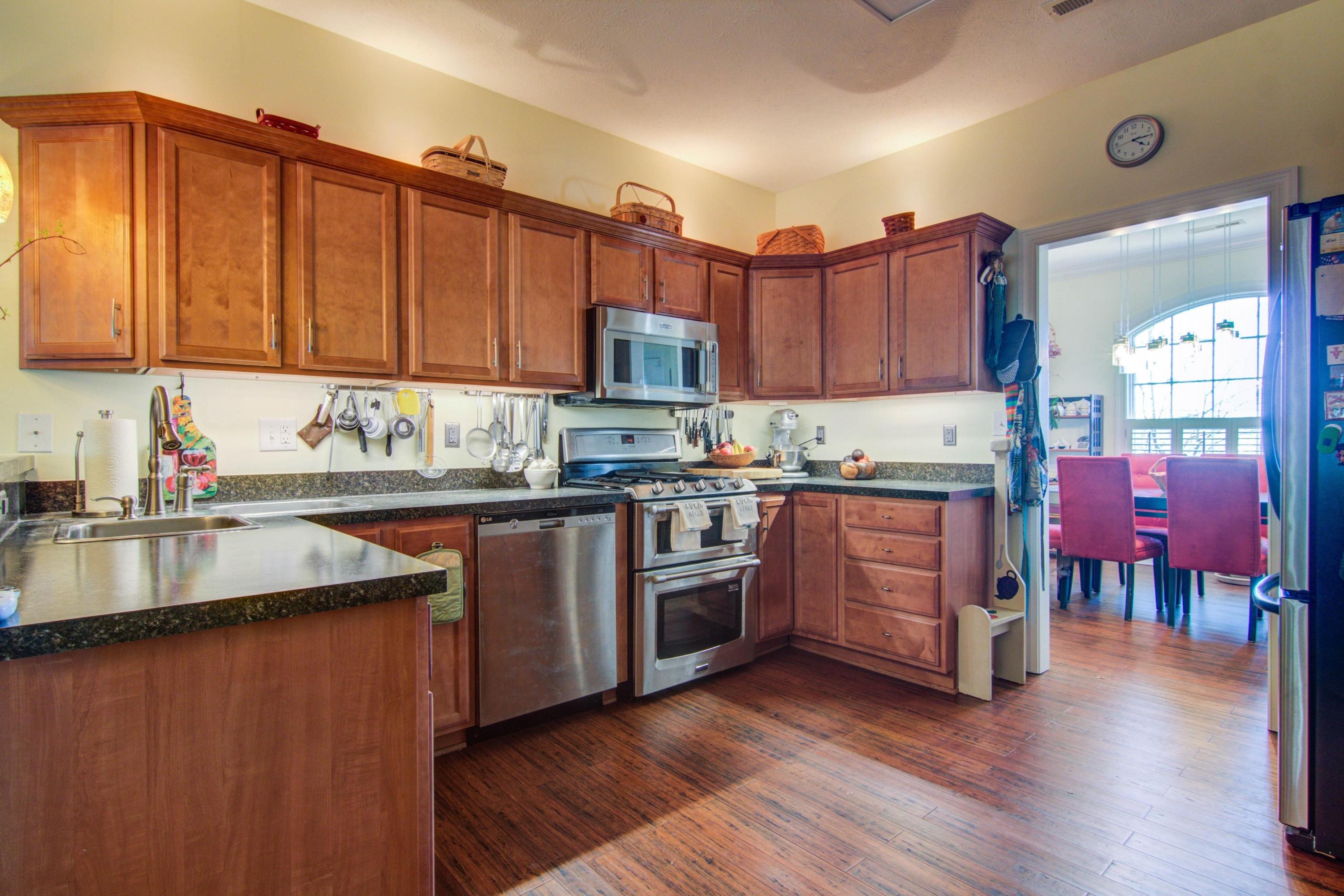1129 Mountain View Road Vinton, VA 24179 - Photo 7 of 24 a kitchen with stainless steel appliances granite countertop a sink a stove and a refrigerator