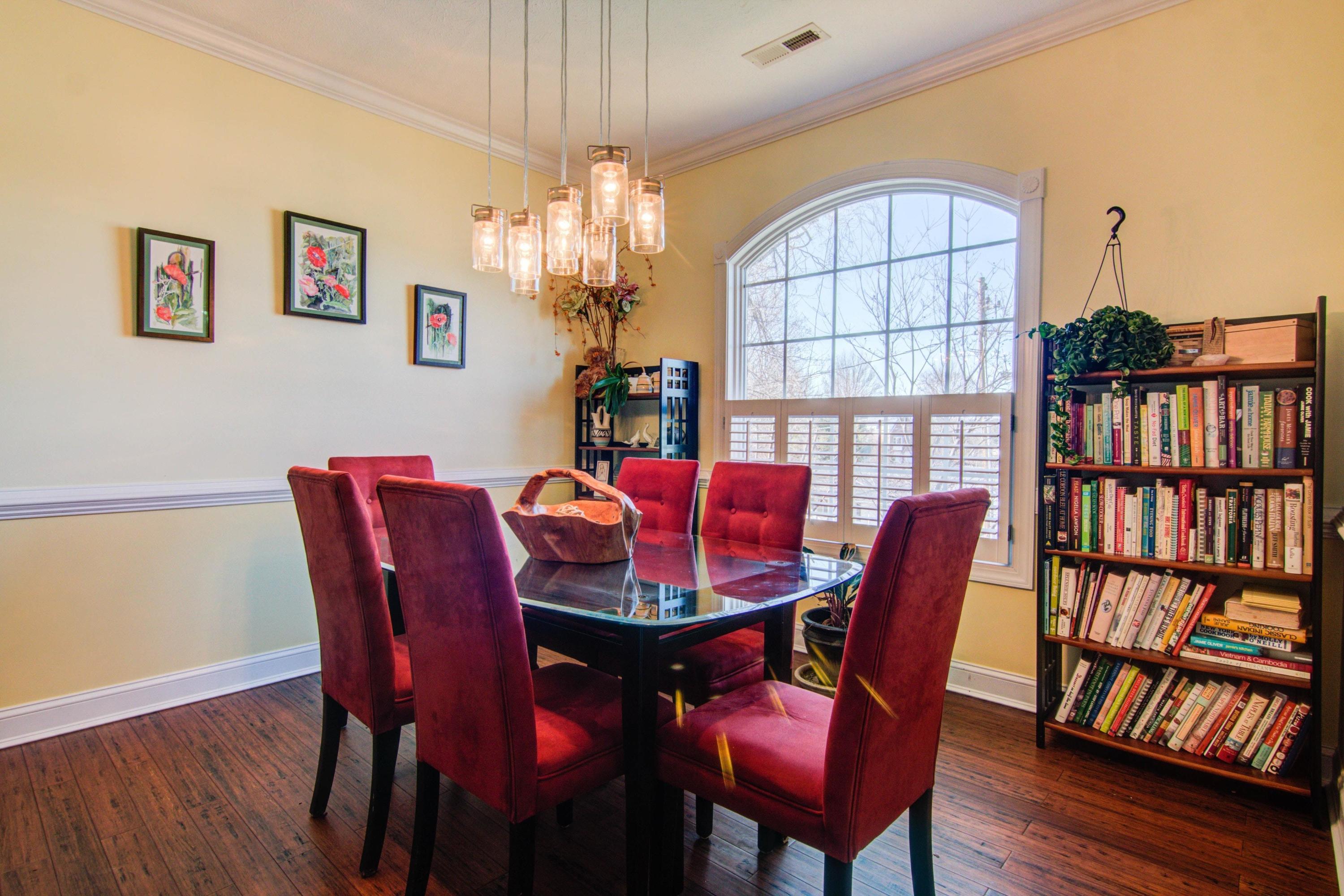 1129 Mountain View Road Vinton, VA 24179 - Photo 9 of 24 a view of a dining room with furniture chandelier and wooden floor